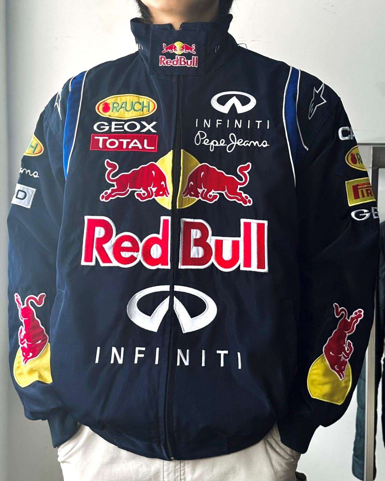 Red Bull Racing jacket featuring bold colors and the iconic logo, designed for motorsport enthusiasts and fans.
