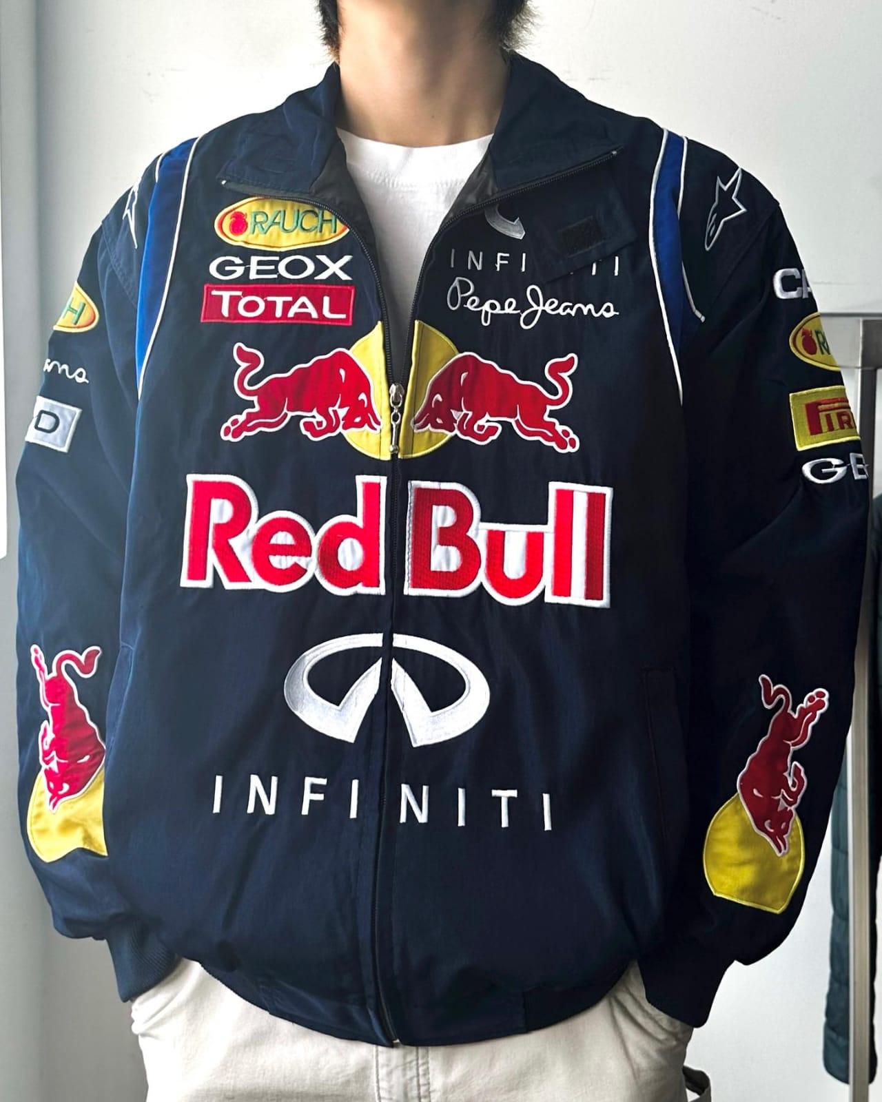 Model showcasing a stylish Red Bull Racing jacket, perfect for racing events and casual wear, highlighting the team’s branding