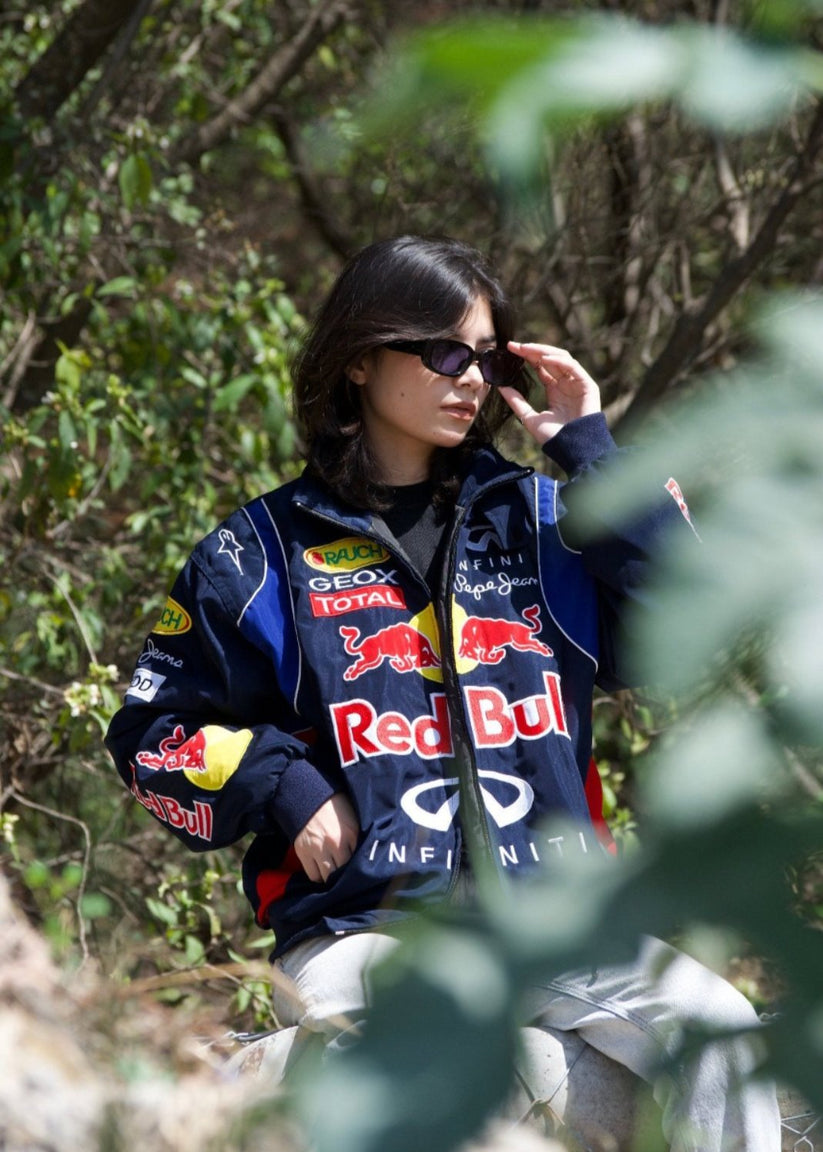 Red Bull Racing Jacket by DWNTWN featuring official team logos.