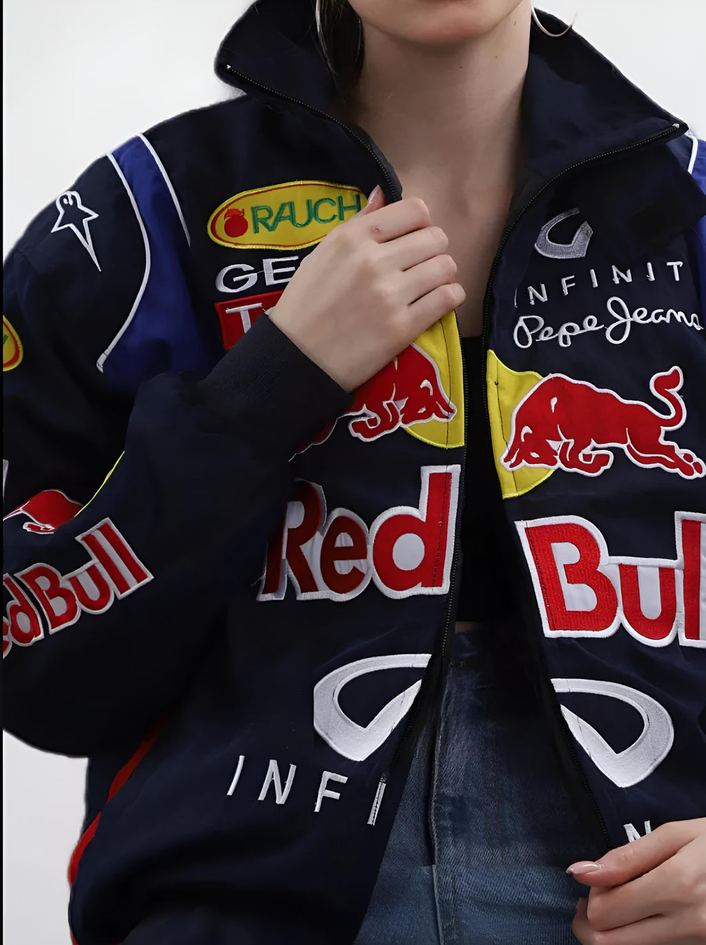 Person wearing a jacket with Red Bull and Infiniti logos clos shot