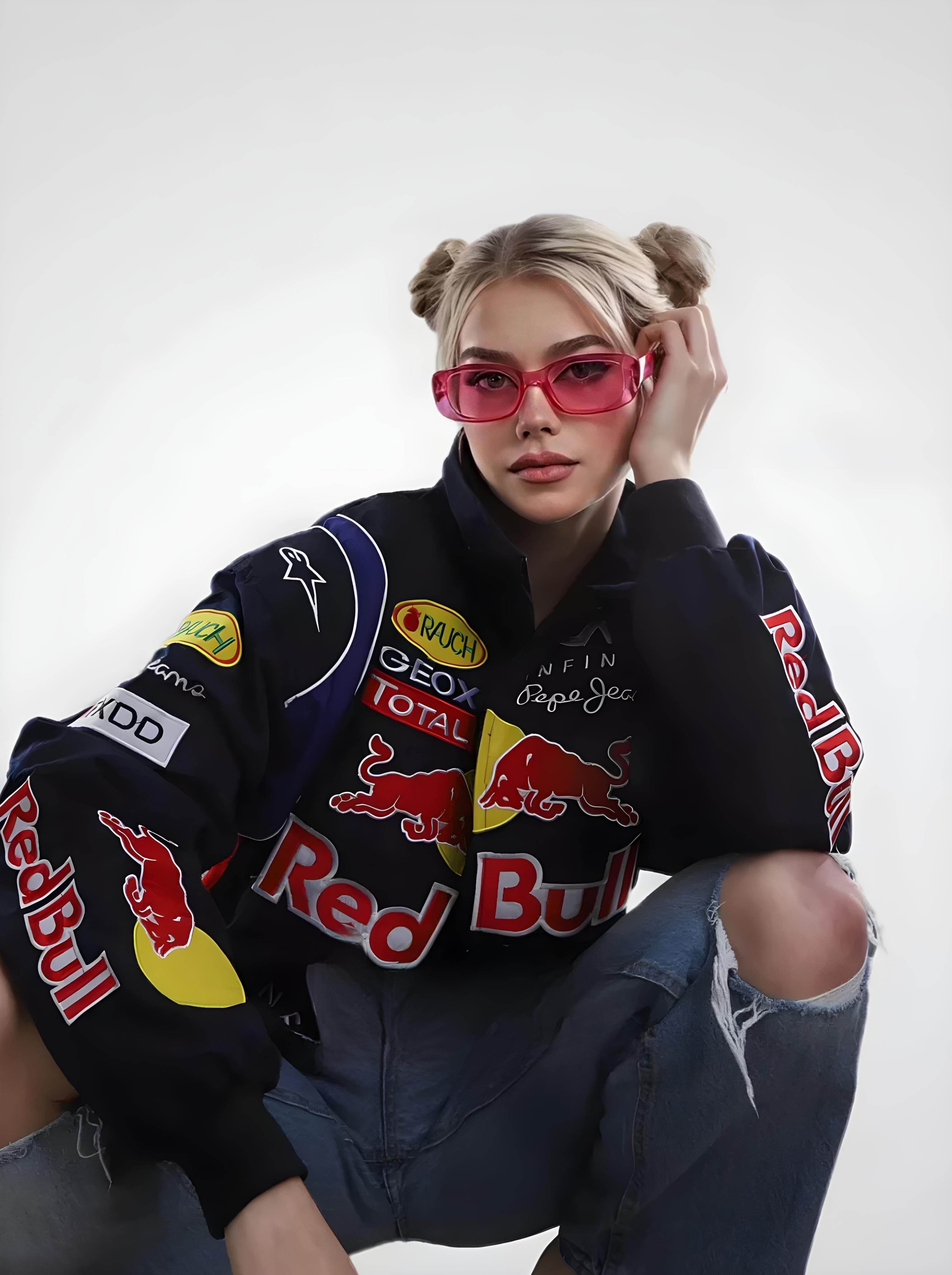 Person wearing a Red Bull branded jacket with various logos on a white background