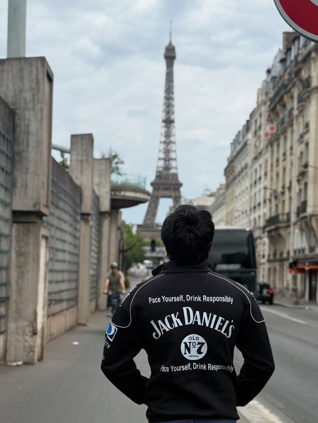 Model wearing DWNTWN Jack Daniels racing jacket black bomber streetwear Paris