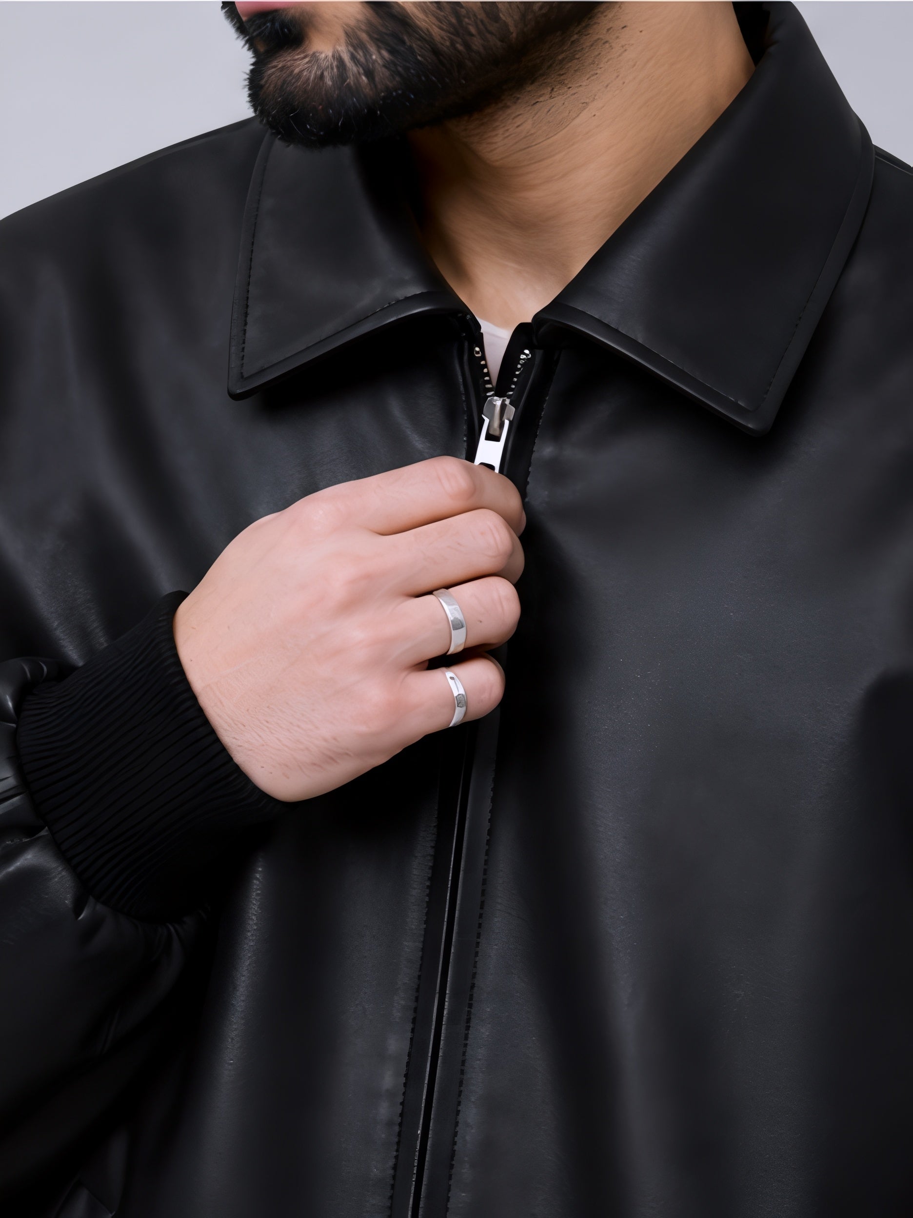 minimal black leather jacket close up zipper detail