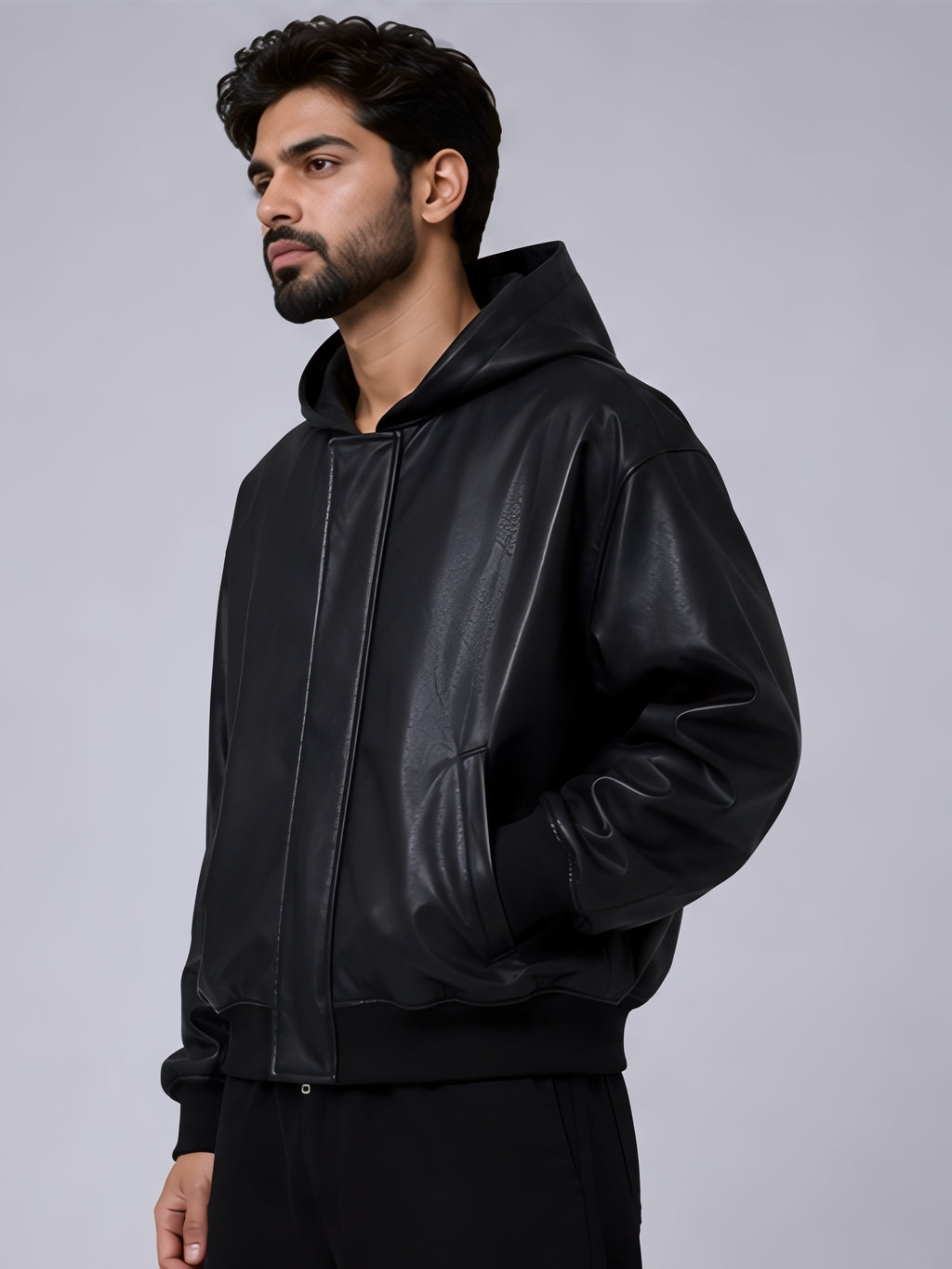 Black PU leather jacket with attached hood side profile showing grip or rib on sleeves