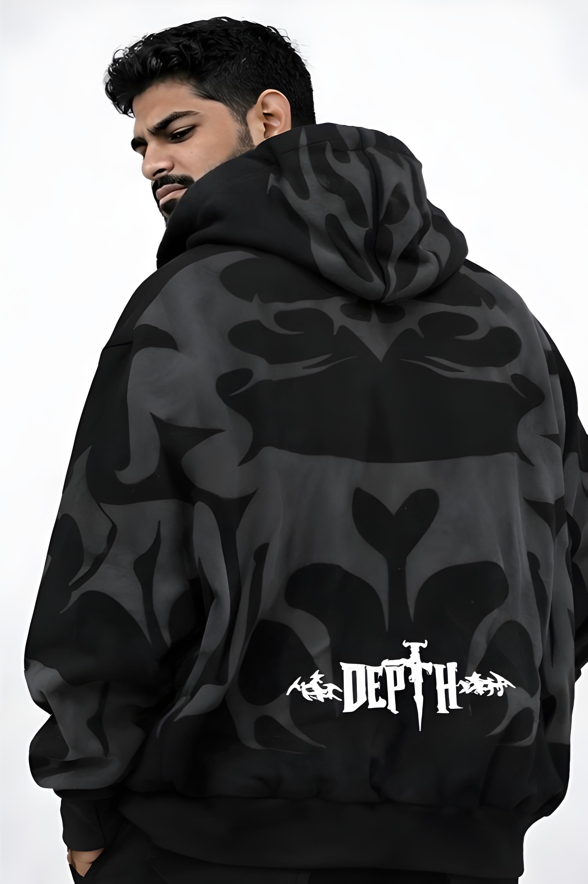 Person wearing a black hoodie with a floral pattern and 'DEPTH' branding on the back.