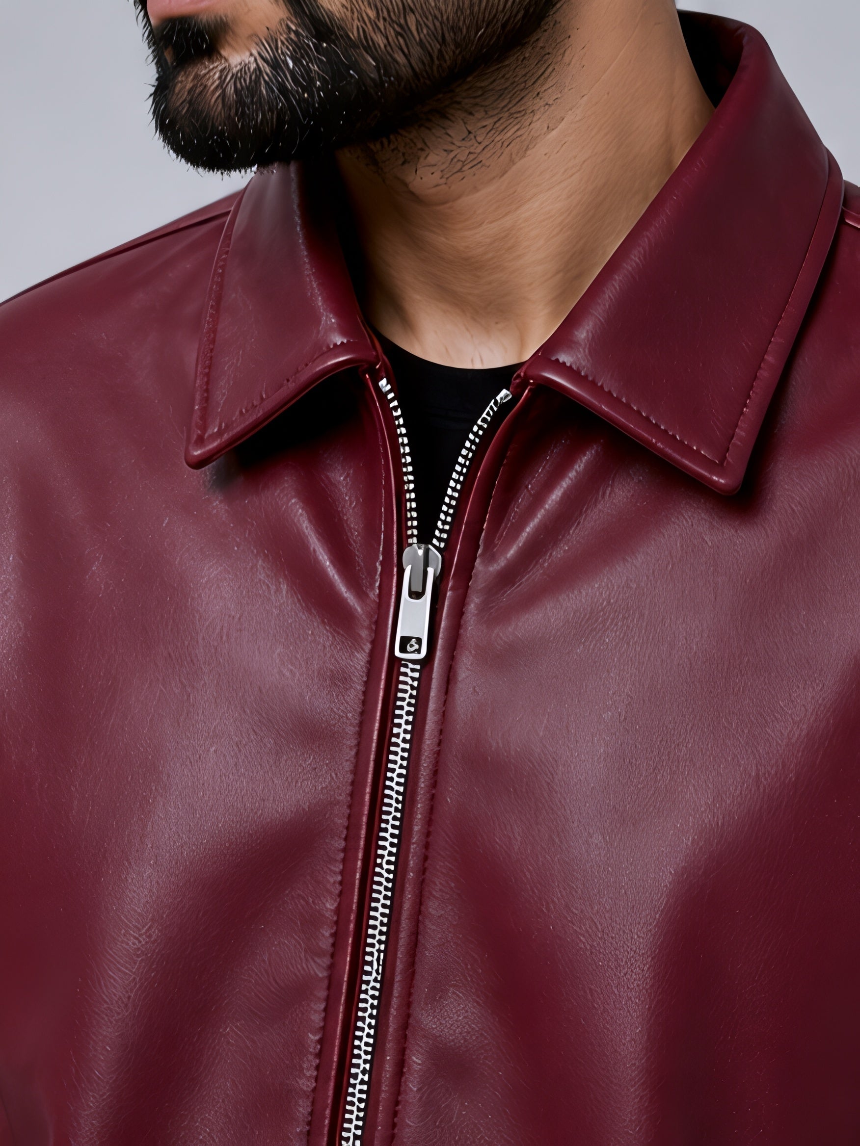 premium maroon leather jacket close up zipper detail