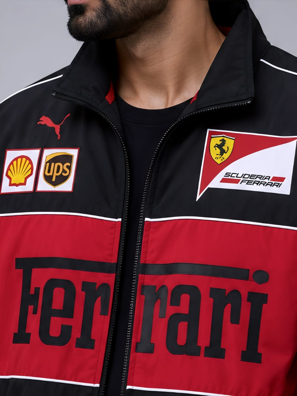 Close-up shot of the parachute fabric texture and zippered collar details on a black ferrari bomber jacket